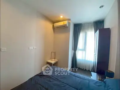 Cozy bedroom with modern air conditioning and natural light