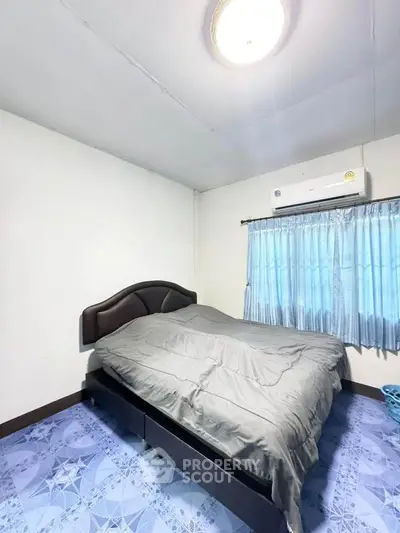 Cozy bedroom with modern air conditioning and stylish bed, perfect for restful nights.