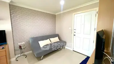 Cozy living room with modern sofa and stylish decor in a contemporary apartment.