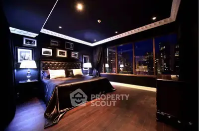 Luxurious dark-themed bedroom with city view, elegant decor, and ambient lighting.