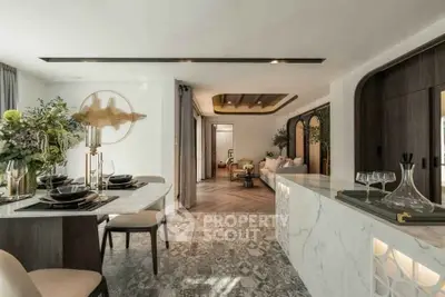 Luxurious open-plan living and dining area with elegant decor and modern furnishings.
