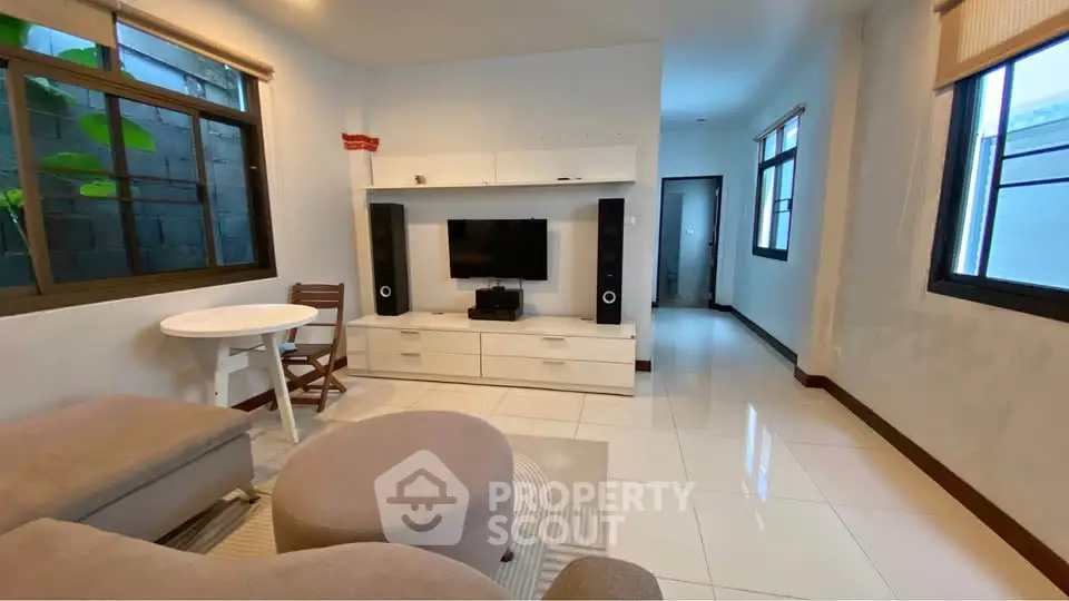 Modern living room with sleek furniture and entertainment center