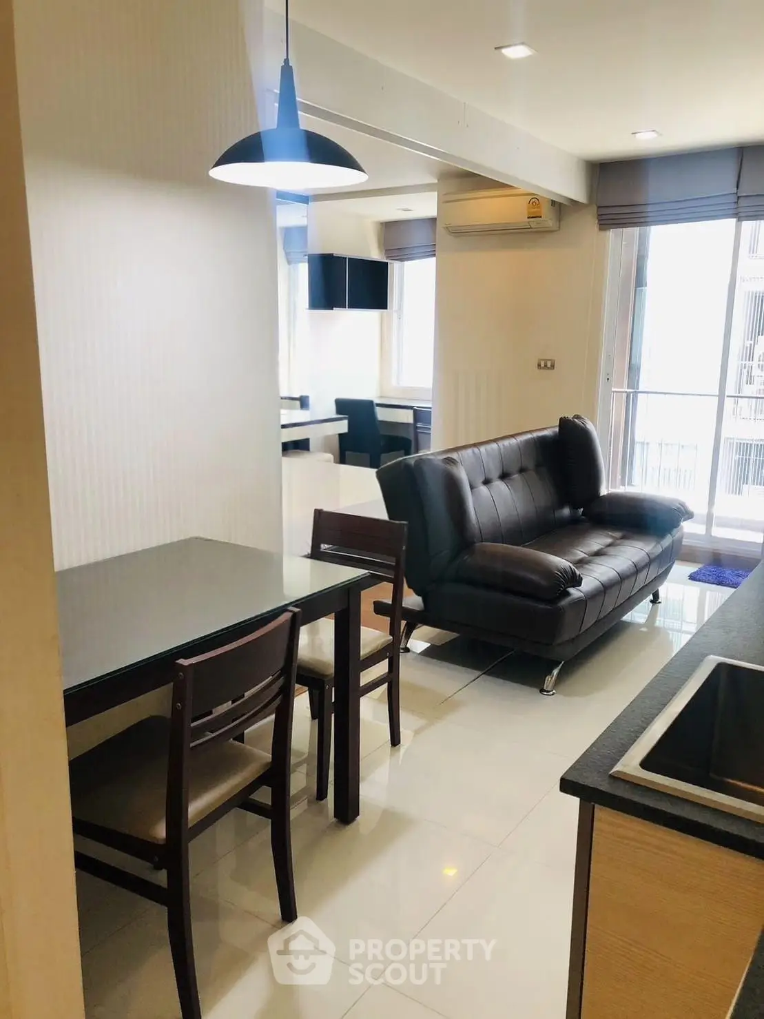 Modern living room with sleek furniture and open layout in a stylish apartment.