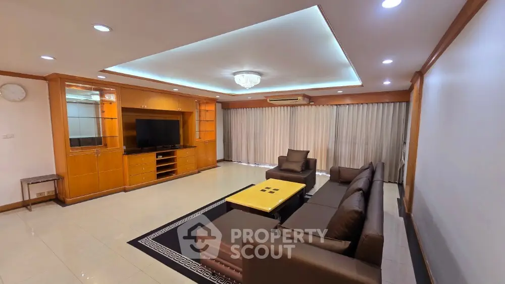 Spacious living room with modern furniture and elegant lighting
