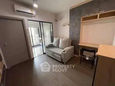 Modern living room with cozy sofa and workspace in stylish apartment