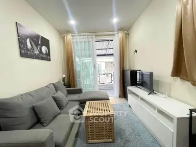 Cozy living room with modern decor and balcony view