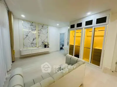 Luxurious living room with elegant marble decor and spacious walk-in closet