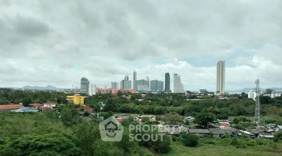 Stunning cityscape view with lush greenery and modern skyline, perfect for urban living enthusiasts.