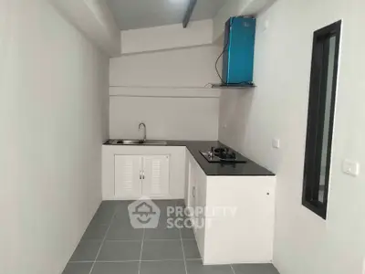 Compact modern kitchen with sleek design and gas stove