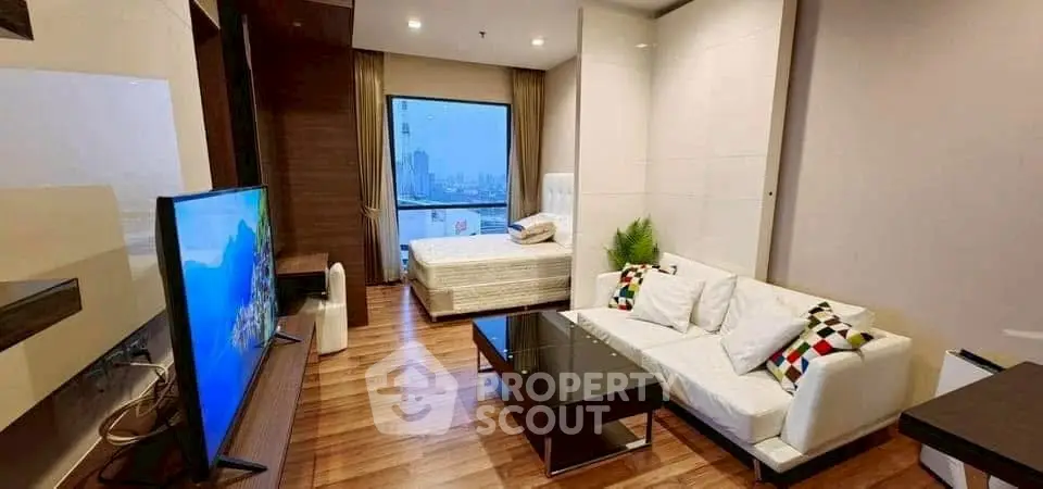 Modern studio apartment with stylish living area and city view.