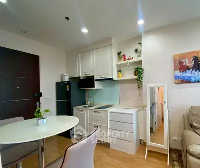 Modern open-layout kitchen with dining area in stylish apartment