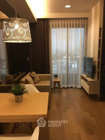 Modern living room with elegant decor and large window view