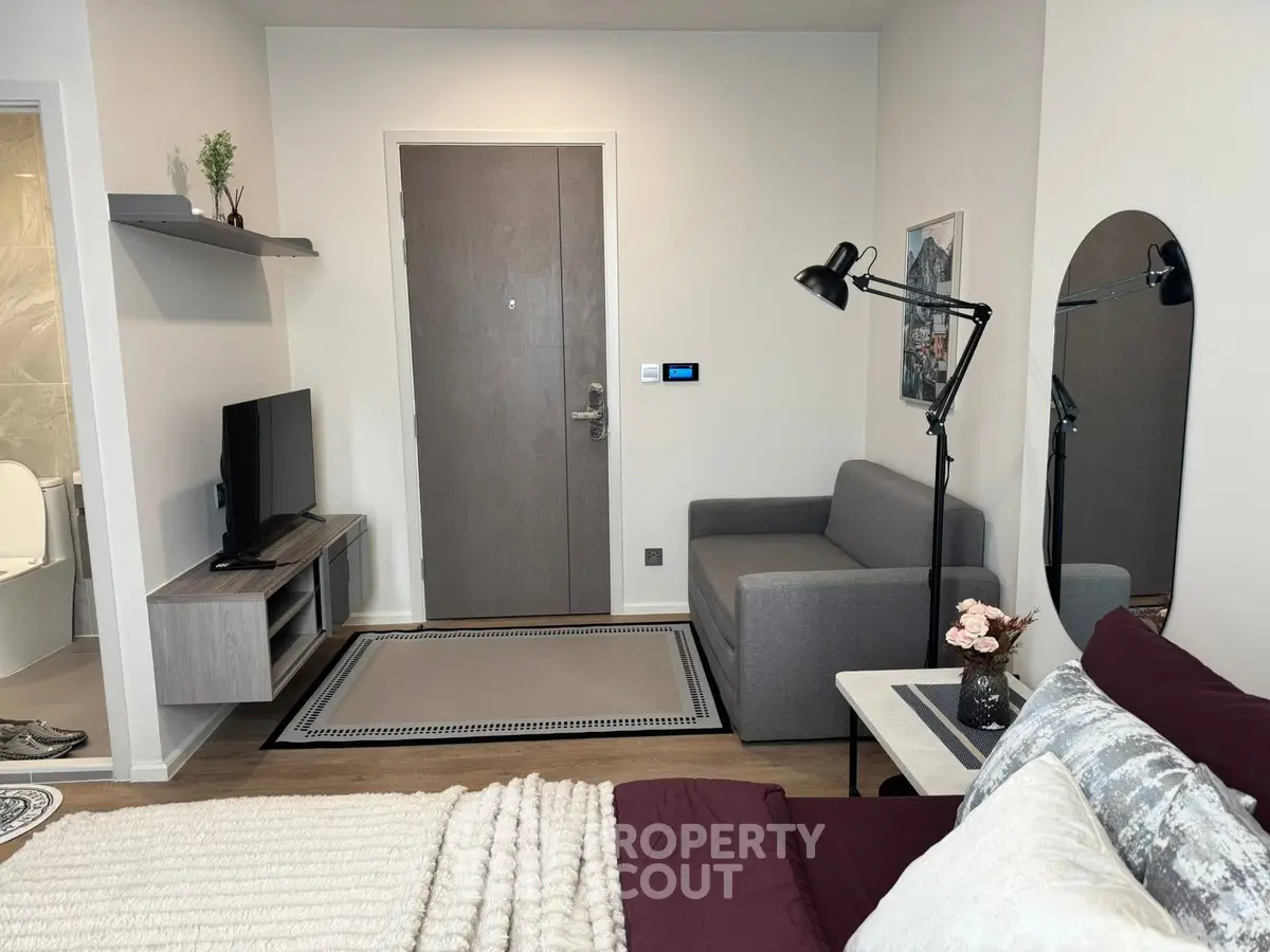 Modern studio apartment with cozy living area and stylish decor