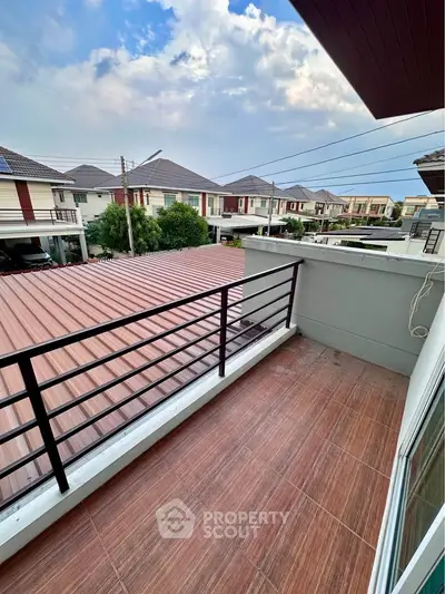 Charming balcony with scenic neighborhood view, perfect for relaxation and enjoying the outdoors.