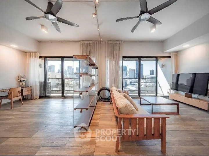 Spacious modern living room with city view and stylish wooden furniture