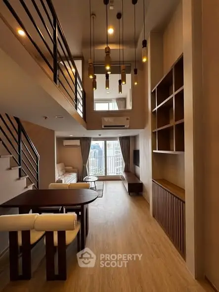 Stunning modern loft with high ceilings and elegant lighting in a spacious living area.