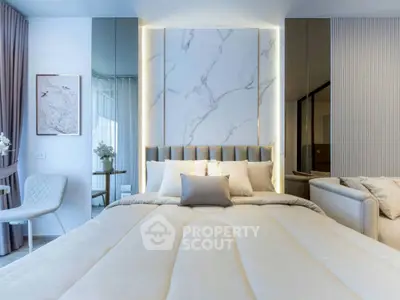 Luxurious modern bedroom with elegant decor and plush bedding, featuring a stylish marble accent wall.