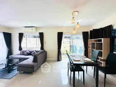 Modern living and dining area with stylish furniture and natural light