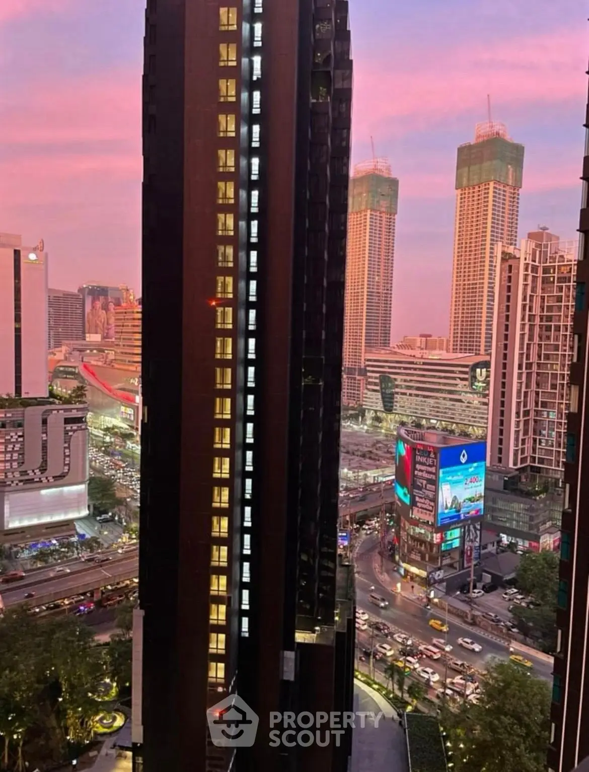 Stunning urban skyline view with modern high-rise buildings at sunset.