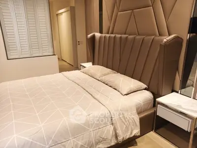 Luxurious bedroom with elegant headboard and modern decor