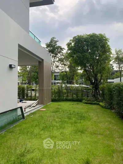 Modern home with lush green garden and spacious outdoor area