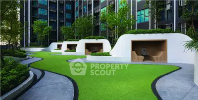 Modern apartment building with lush garden and unique seating areas