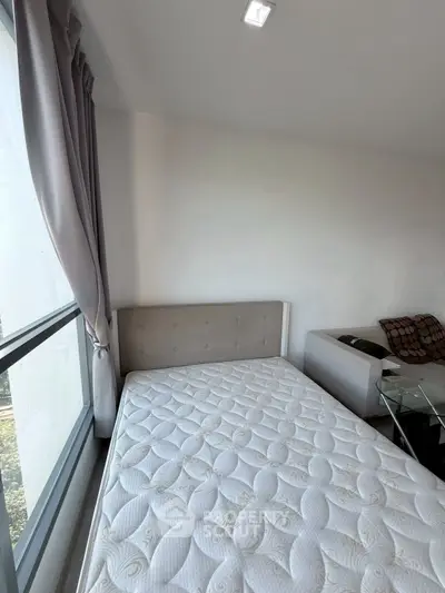 Modern bedroom with large window and stylish decor