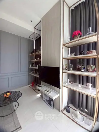 Modern living room with stylish shelving and wall-mounted TV, perfect for contemporary urban living.