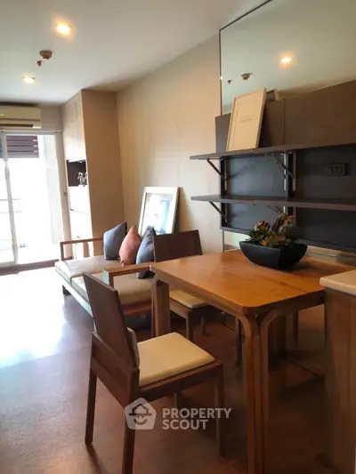 Modern living room with wooden furniture and natural light, perfect for cozy gatherings.