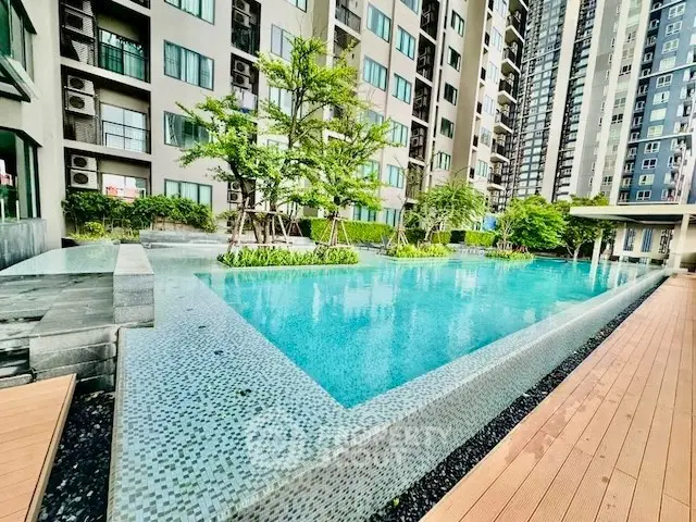 Luxurious condominium with stunning outdoor pool and modern architecture.