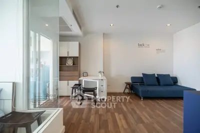 Modern living room with wooden flooring and stylish furniture
