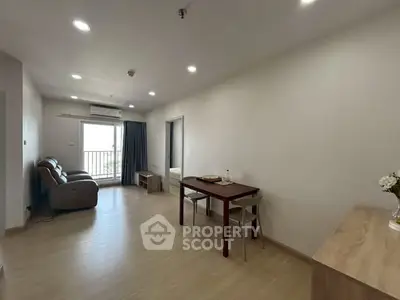 Spacious living room with modern furniture and natural light