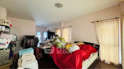 Spacious bedroom with natural light and ample storage potential.