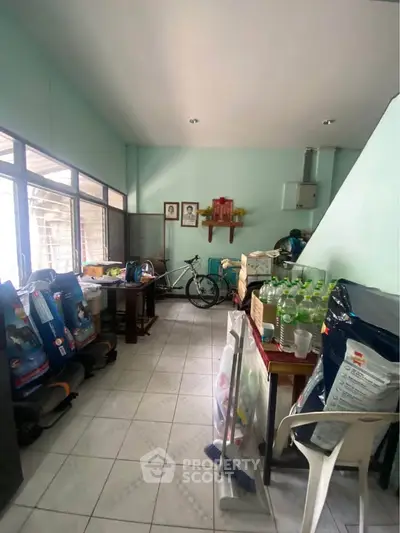 Spacious storage room with ample natural light and organized layout