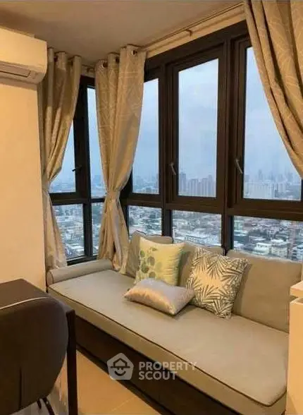Cozy corner unit with panoramic city view and stylish decor.