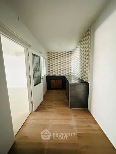 Modern minimalist interior with stylish cabinetry and textured wall design
