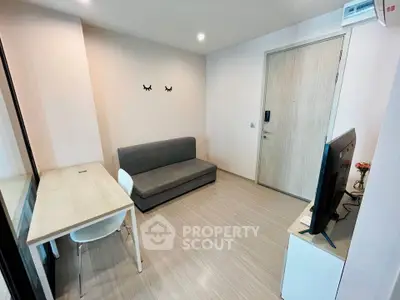 Modern living room with sleek furniture and minimalist design, perfect for urban living.