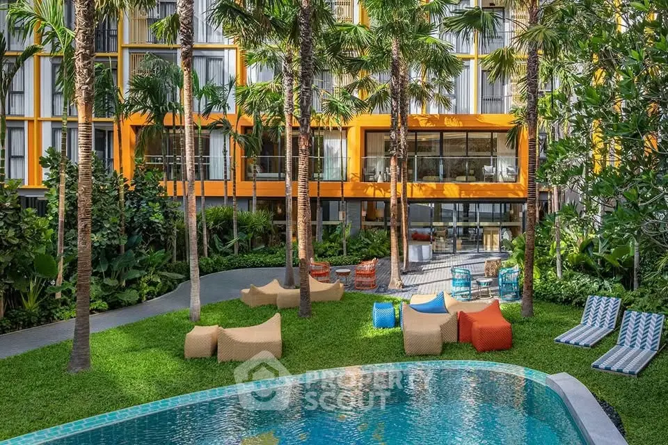 Luxurious modern apartment complex with vibrant garden and pool area, perfect for relaxation and leisure.