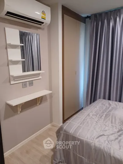 Cozy bedroom with air conditioning and elegant curtains, perfect for restful nights.
