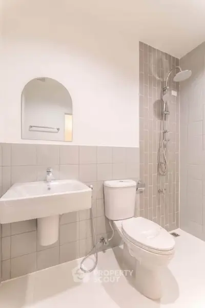 Modern minimalist bathroom with sleek fixtures and neutral tiles