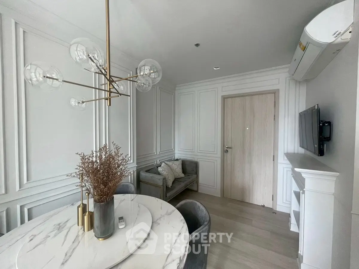 Elegant living room with modern chandelier and stylish decor