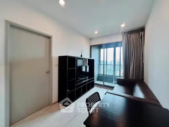 Modern living room with sleek furniture and city view balcony