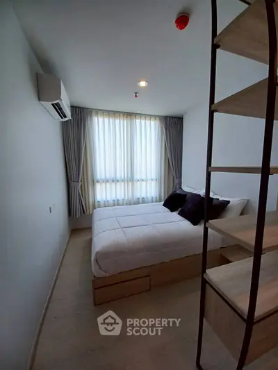 Cozy modern bedroom with natural light and stylish decor