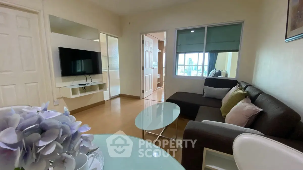 Cozy living room with modern decor and city view window.