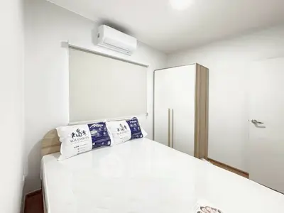 Modern bedroom with air conditioning and sleek wardrobe design