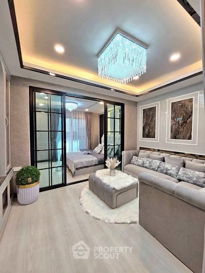 Luxurious living room with elegant chandelier and cozy decor