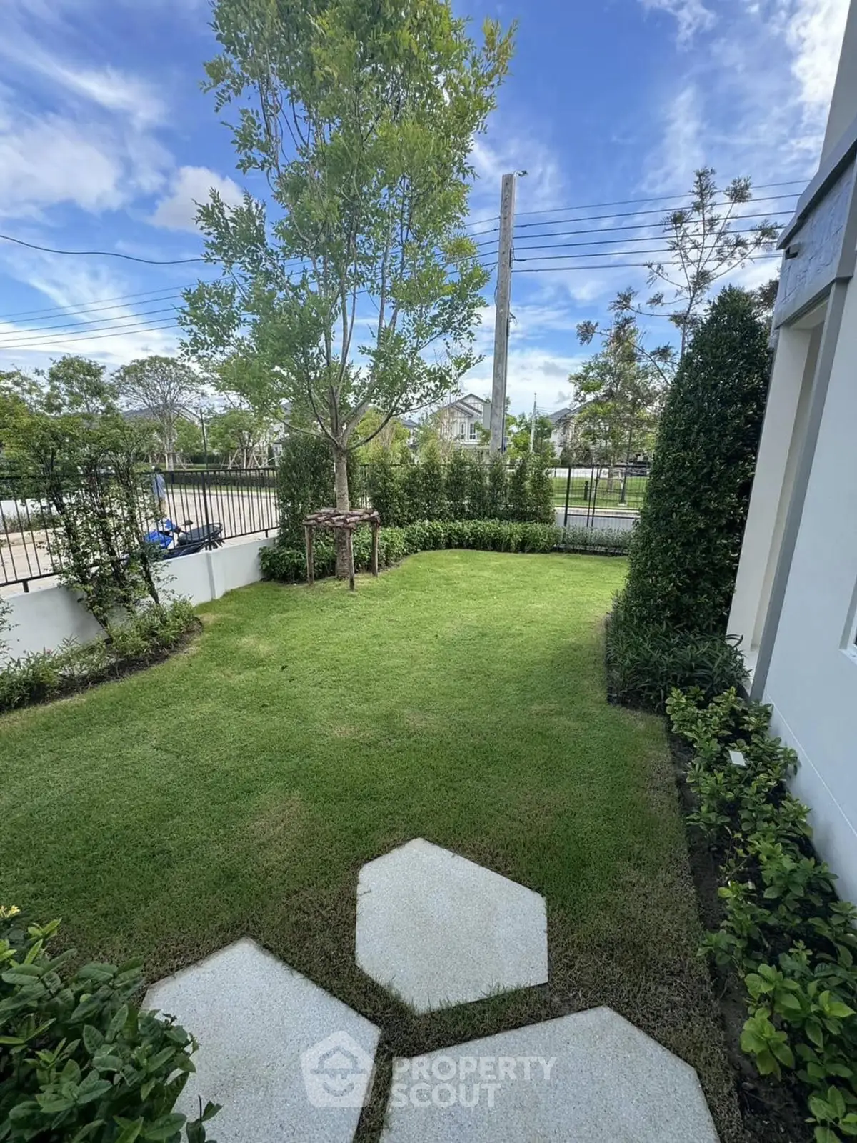 Charming garden view with lush greenery and modern landscaping in a serene residential area.
