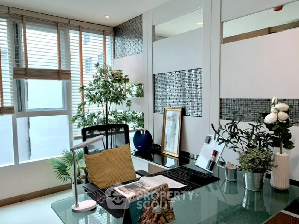 Modern study room with glass desk and stylish decor