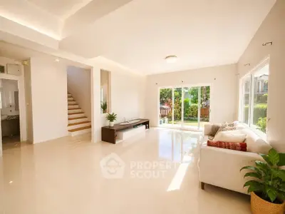 Spacious and bright living room with garden view and modern decor