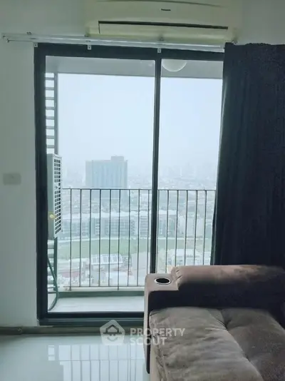 Modern apartment with balcony offering stunning cityscape views, perfect for urban living.